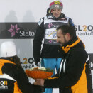 Crown Prince Haakon presents flowers to Daniela Iraschko and the other medalists after the women's ski jumping competition in the normal hill at Midtstuen (Photo: Heiko Junge / Scanpix)